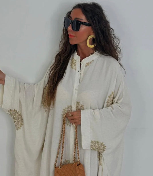 Beige dress embroidered with luxurious gold threads, made in Turkey